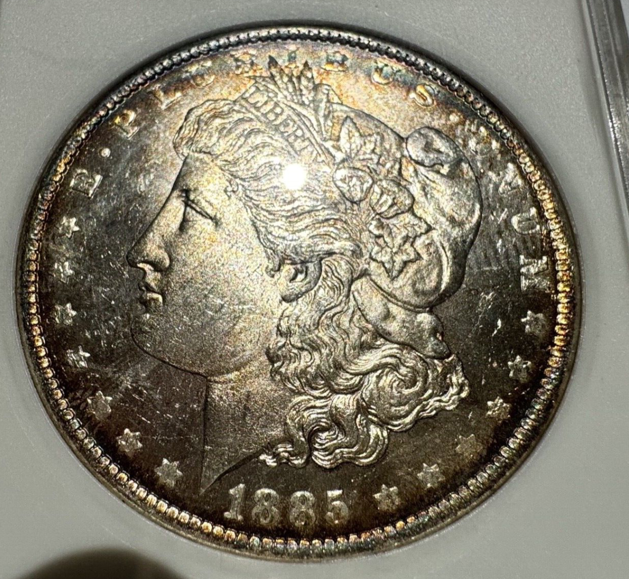 1885-O Morgan Silver Dollar – ANACS Certified MS62 – *End Of Roll Toner*