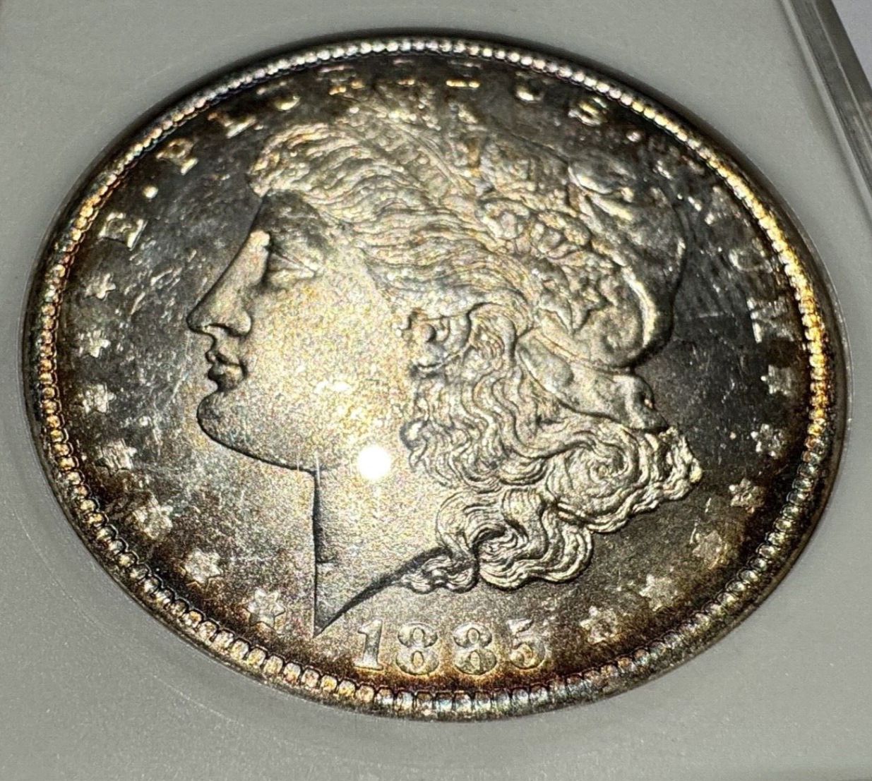 1885-O Morgan Silver Dollar – ANACS Certified MS62 – *End Of Roll Toner*