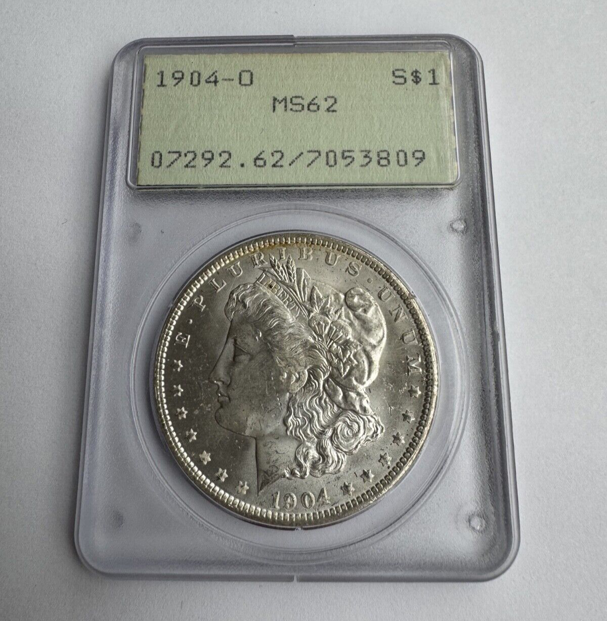 1904-O Morgan Silver Dollar – PCGS Certified MS62 – *Vintage Rattler Holder*