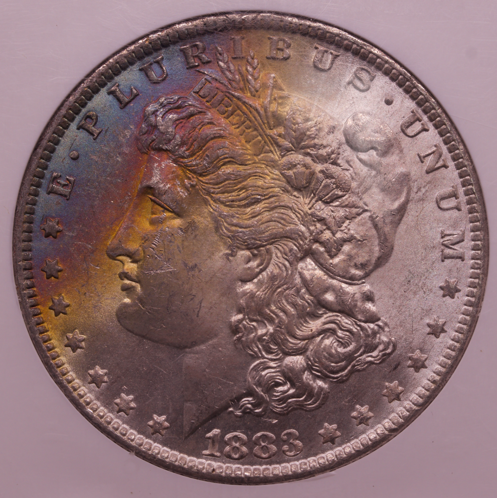 1883-O Morgan Silver Dollar NGC MS63 Rainbow Toned Crescent New Orleans Mint $1
